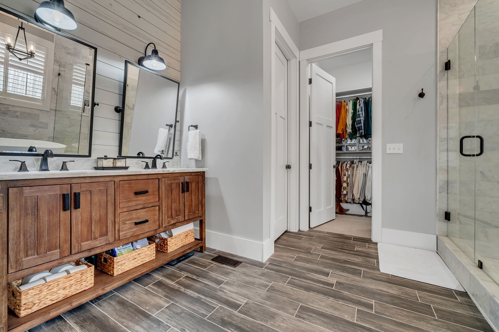 7890 Oscar Green Road Primm Springs, TN 38476 - Photo 25 of 52 a bathroom with a double vanity sink a mirror and a shower