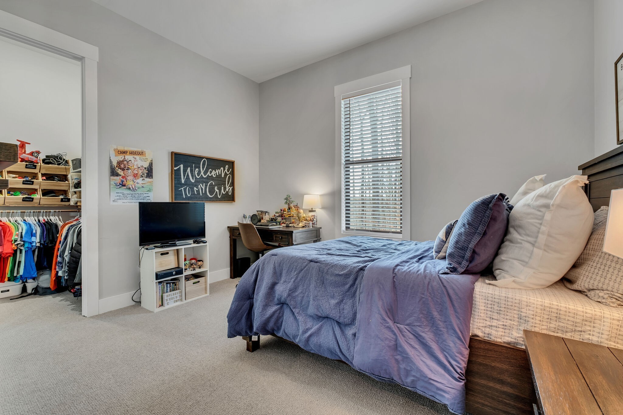 7890 Oscar Green Road Primm Springs, TN 38476 - Photo 27 of 52 a bedroom with a bed and a flat screen tv