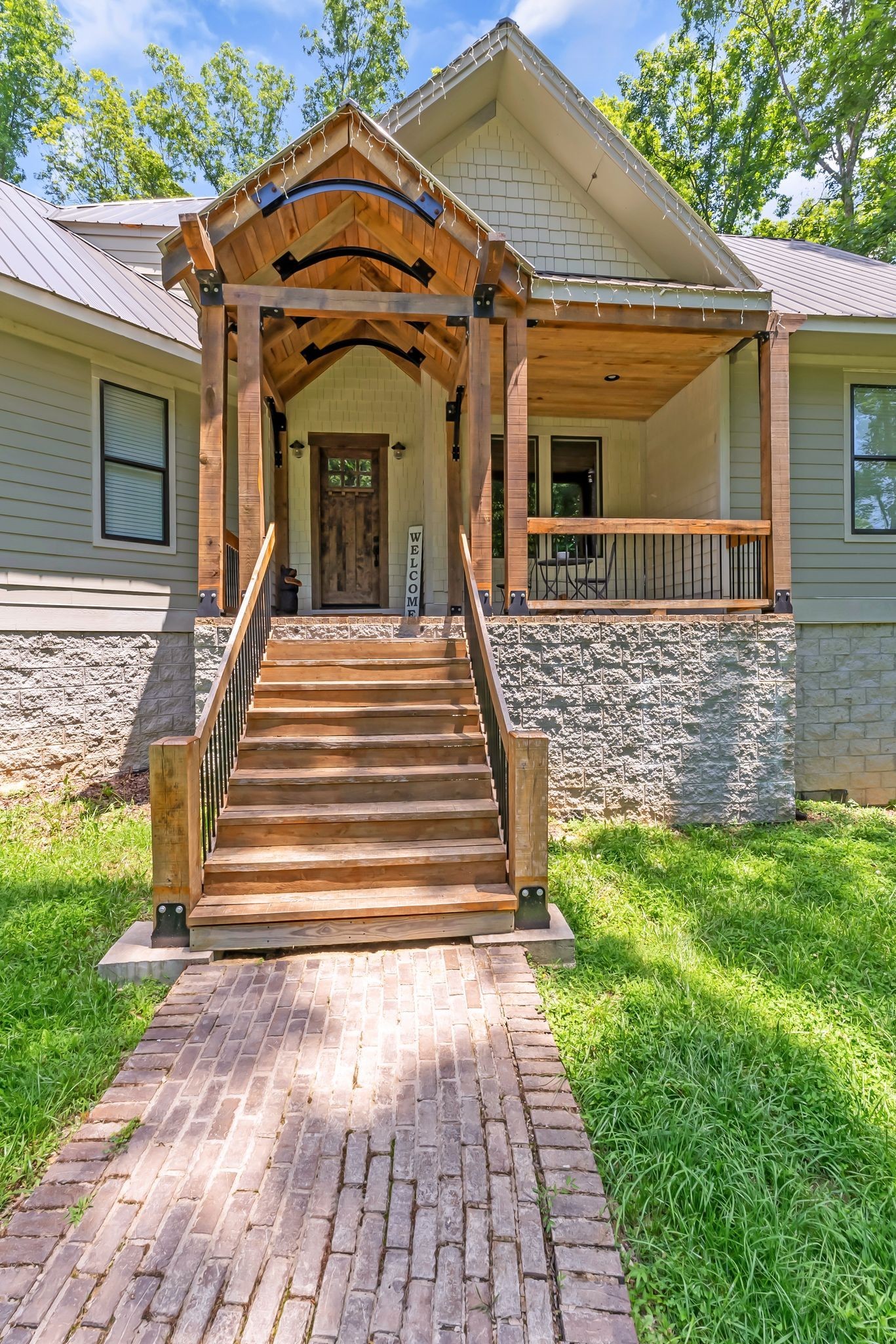 7890 Oscar Green Road Primm Springs, TN 38476 - Photo 3 of 52 a front view of a house with a garden