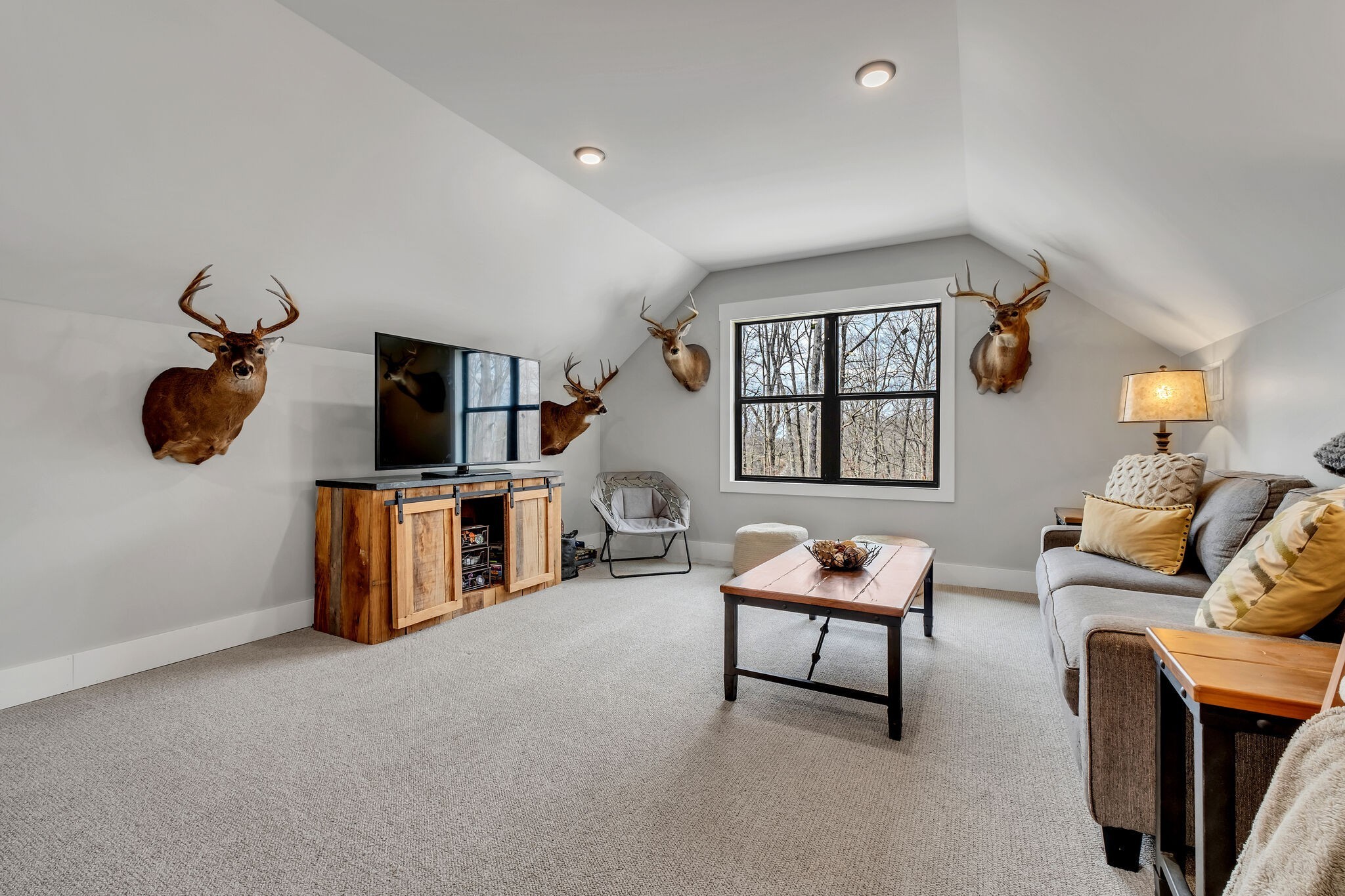 7890 Oscar Green Road Primm Springs, TN 38476 - Photo 37 of 52 a living room with furniture and a flat screen tv