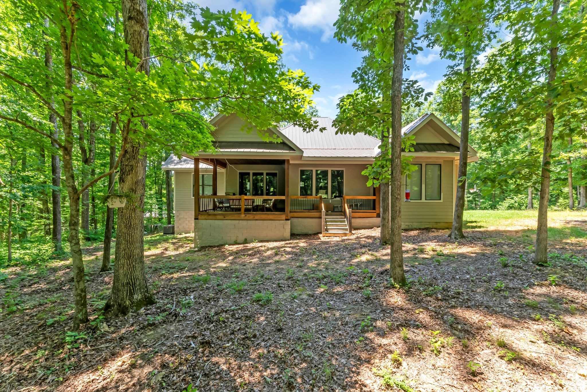 7890 Oscar Green Road Primm Springs, TN 38476 - Photo 42 of 52 a front view of a house with a yard