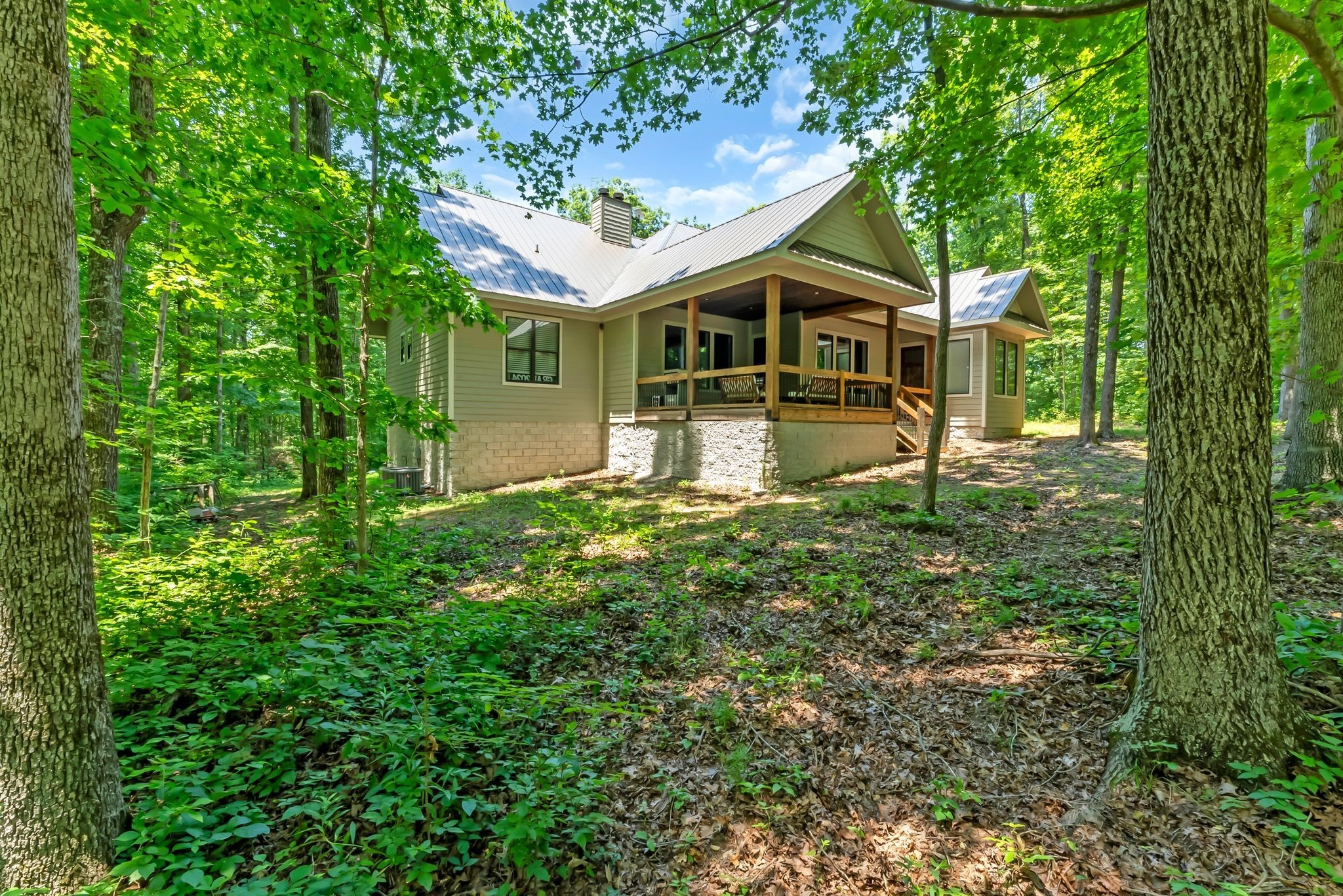 7890 Oscar Green Road Primm Springs, TN 38476 - Photo 43 of 52 a front view of a house with a yard