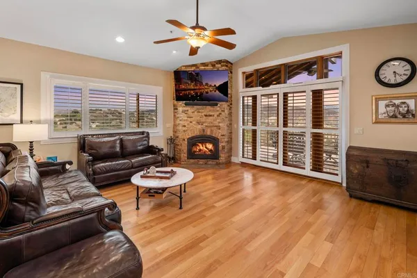 a kitchen with stainless steel appliances granite countertop a kitchen island a stove and a sink