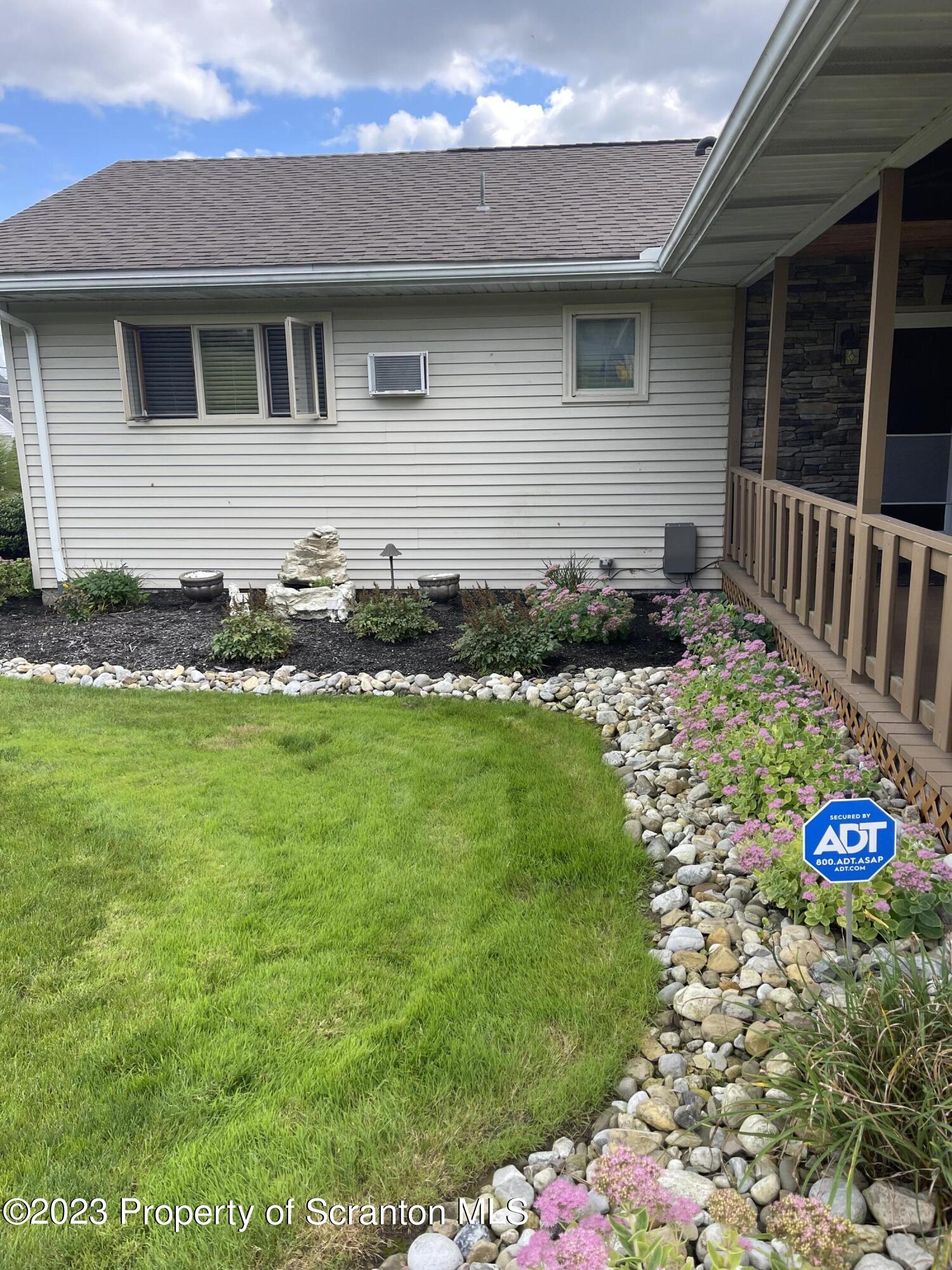 225 Main Street Olyphant, PA 18447 - Photo 16 of 60 a front view of house with yard