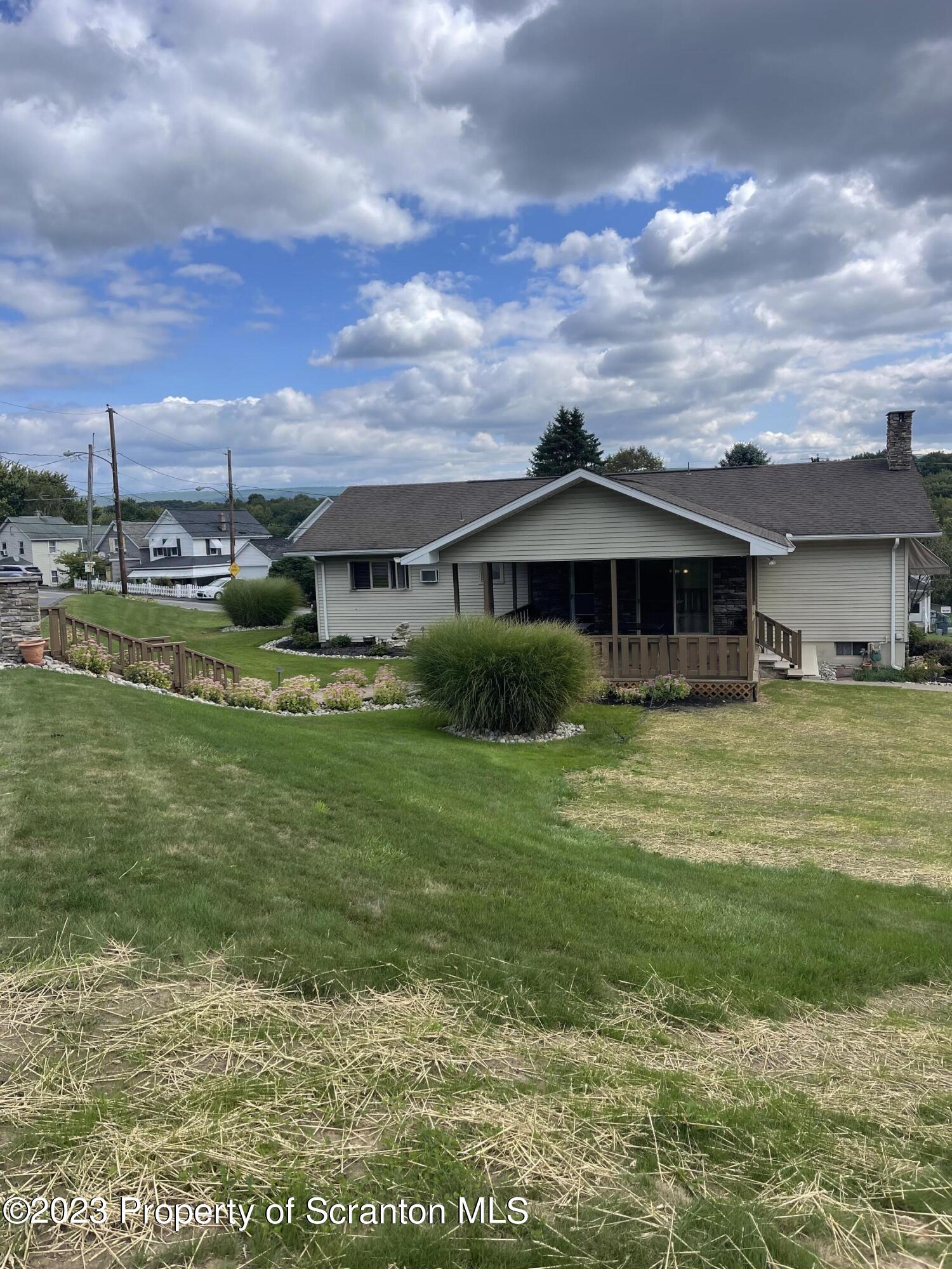 225 Main Street Olyphant, PA 18447 - Photo 17 of 60 a view of a house with a big yard