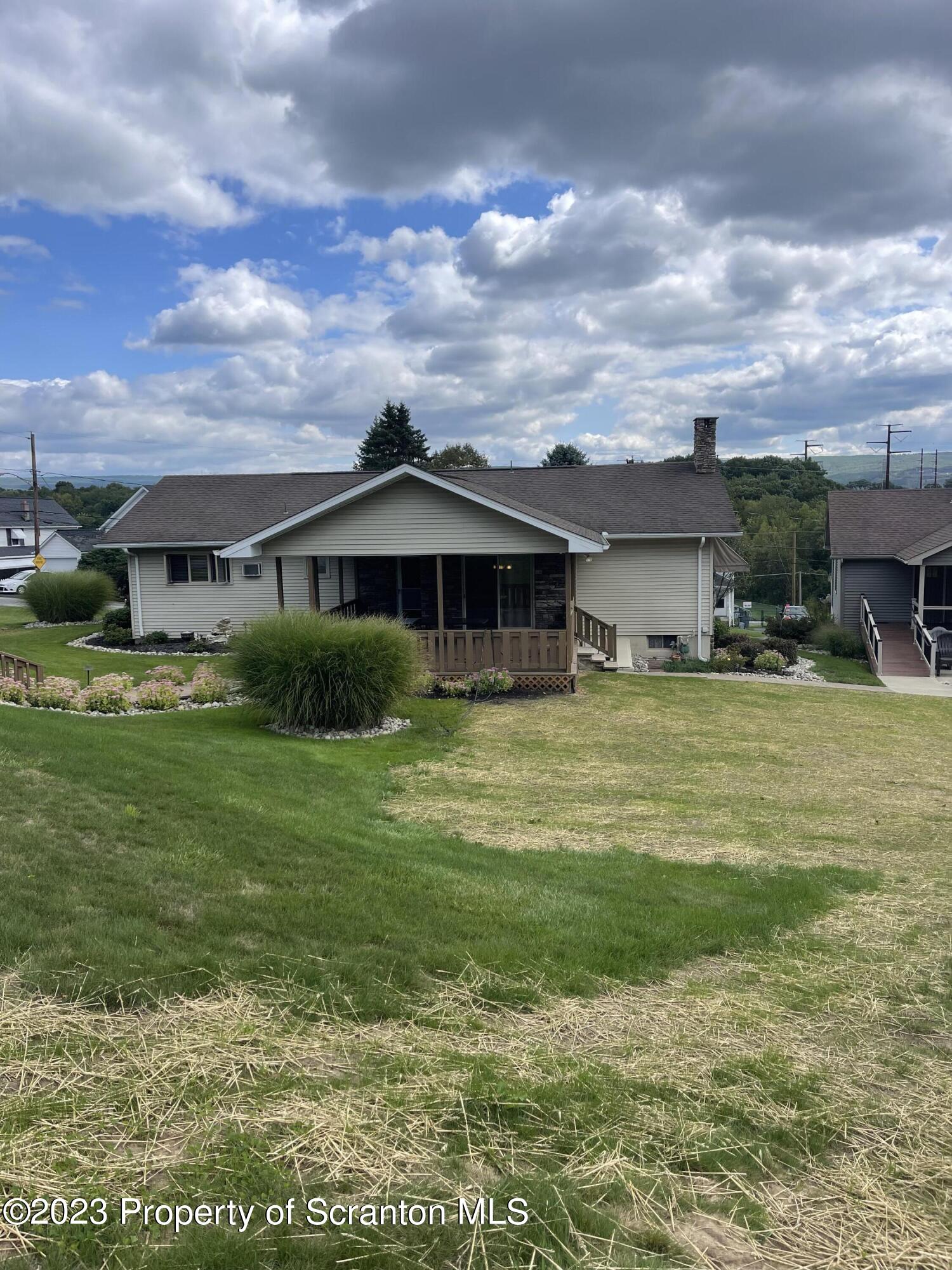 225 Main Street Olyphant, PA 18447 - Photo 19 of 60 a front view of a house with garden