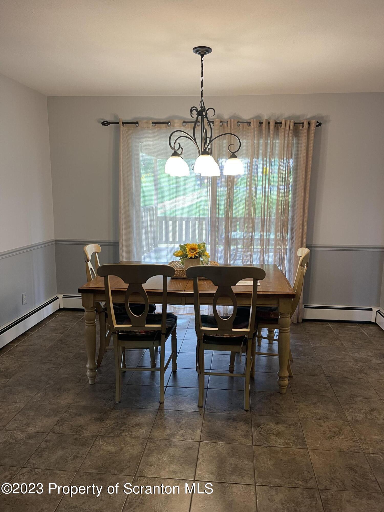 225 Main Street Olyphant, PA 18447 - Photo 21 of 60 a view of a dining room with furniture and window