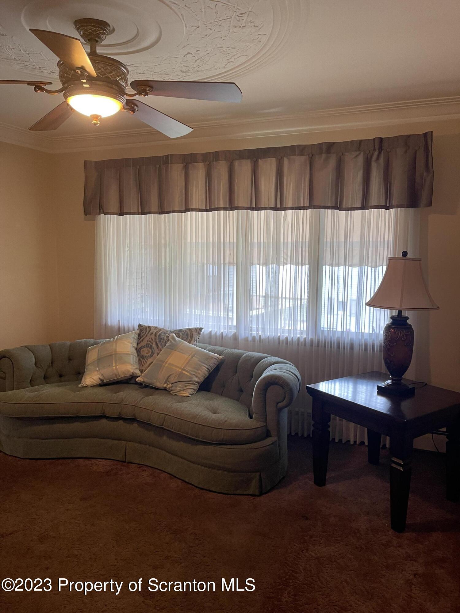 225 Main Street Olyphant, PA 18447 - Photo 26 of 60 a living room with furniture and a piano