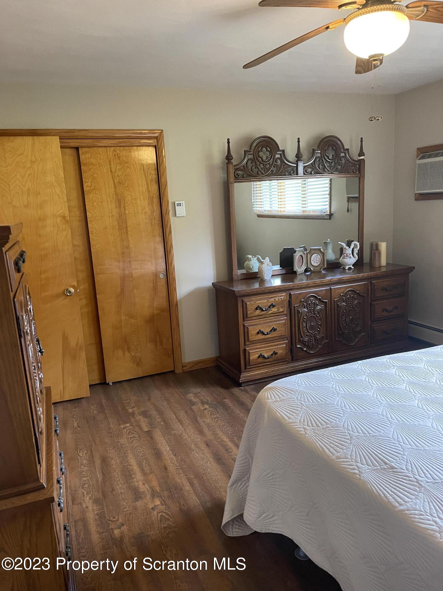 225 Main Street Olyphant, PA 18447 - Photo 33 of 60 a bedroom with a bed and a dresser