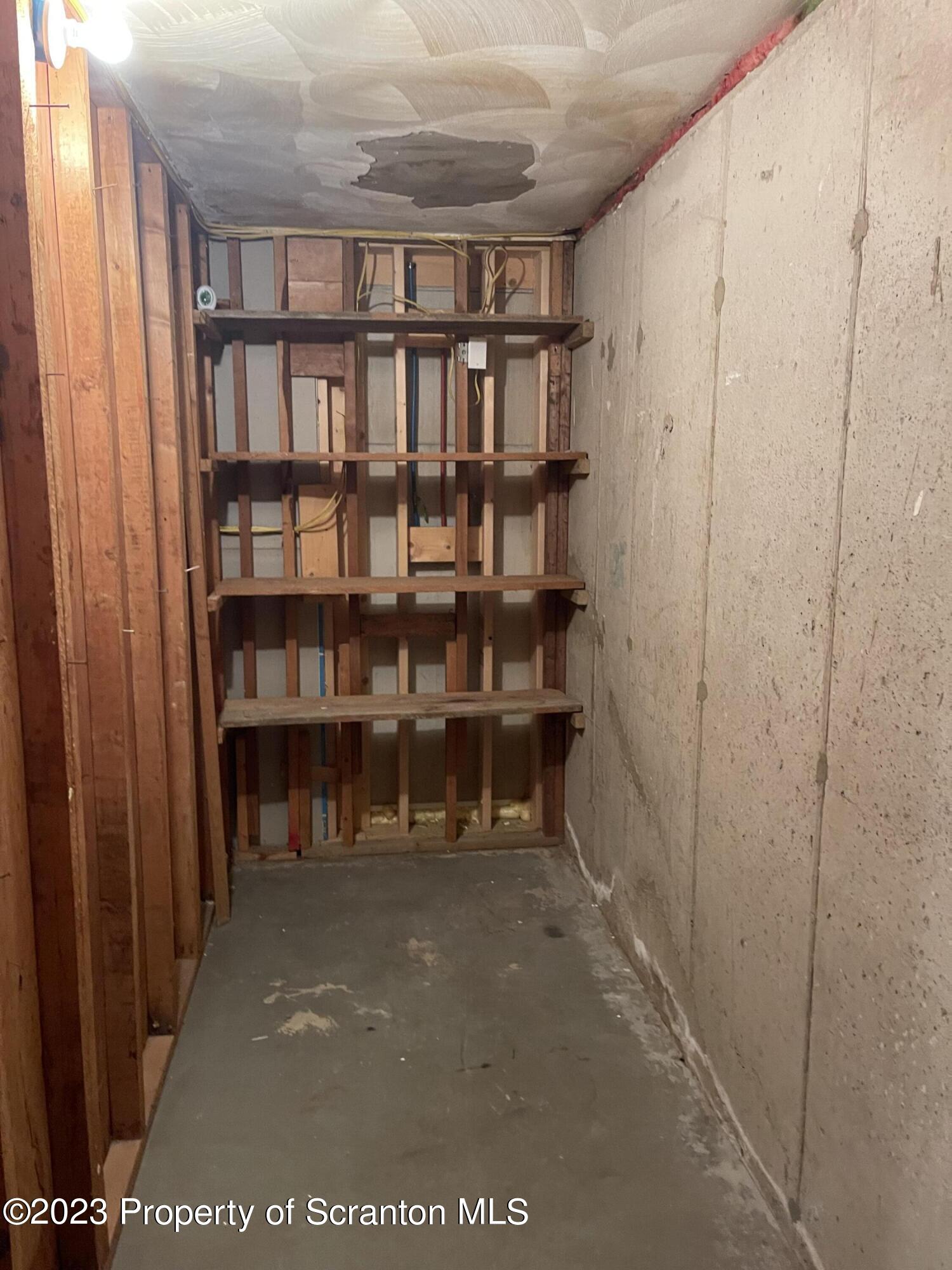 225 Main Street Olyphant, PA 18447 - Photo 59 of 60 a view of a hallway with bookshelf