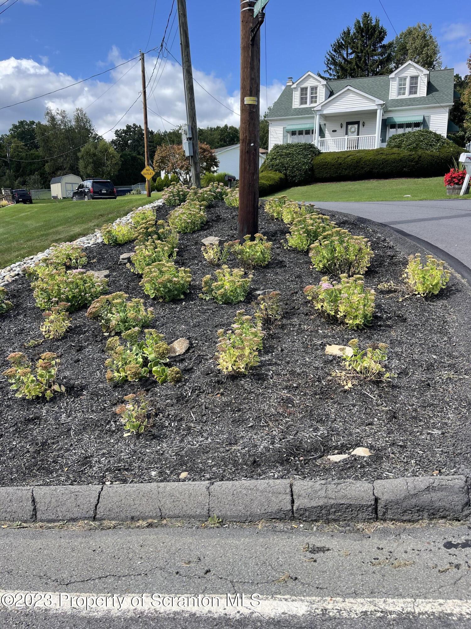 225 Main Street Olyphant, PA 18447 - Photo 6 of 60 a view of a street with a building in the background