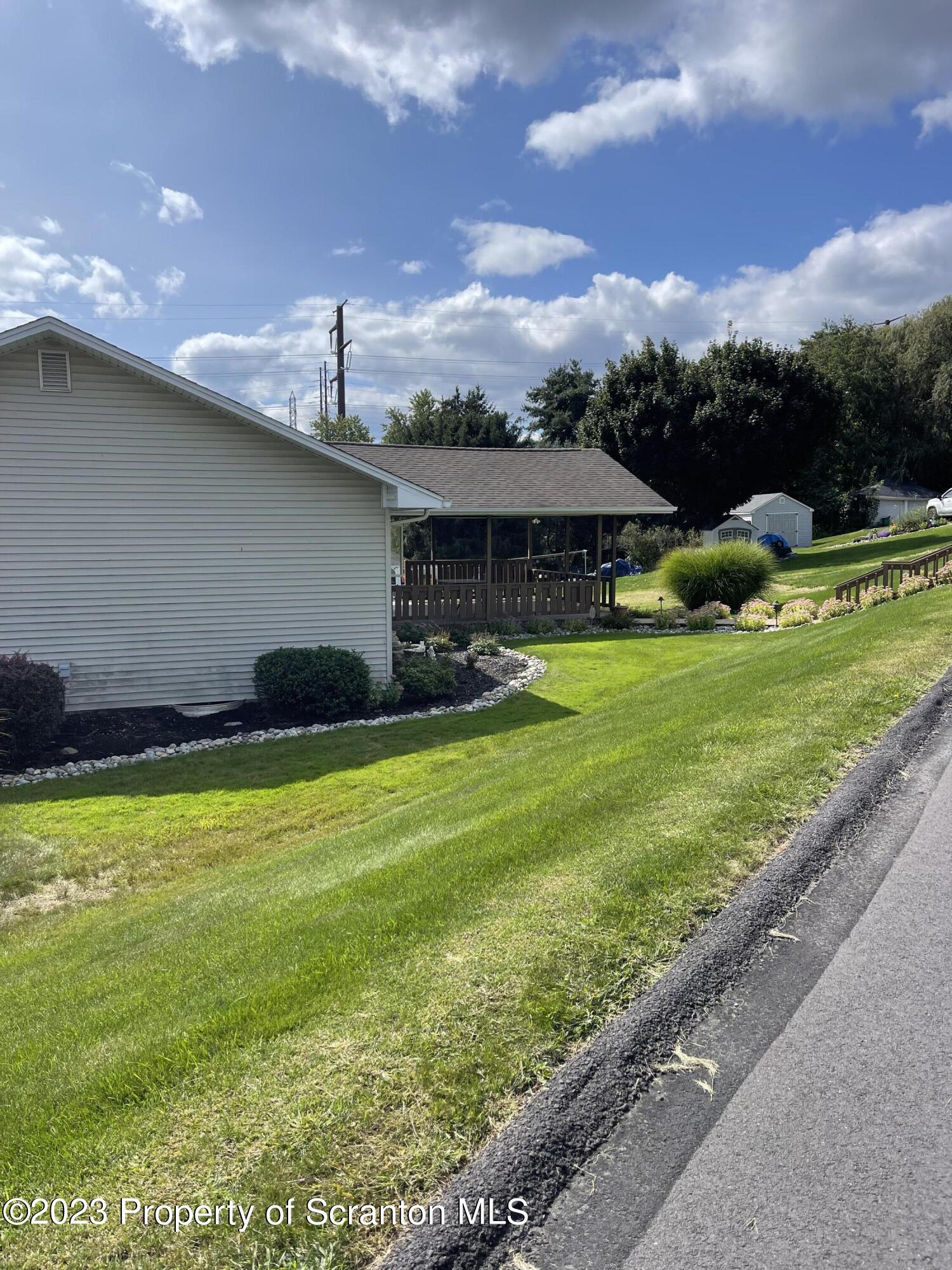 225 Main Street Olyphant, PA 18447 - Photo 7 of 60 a front view of a house with a yard