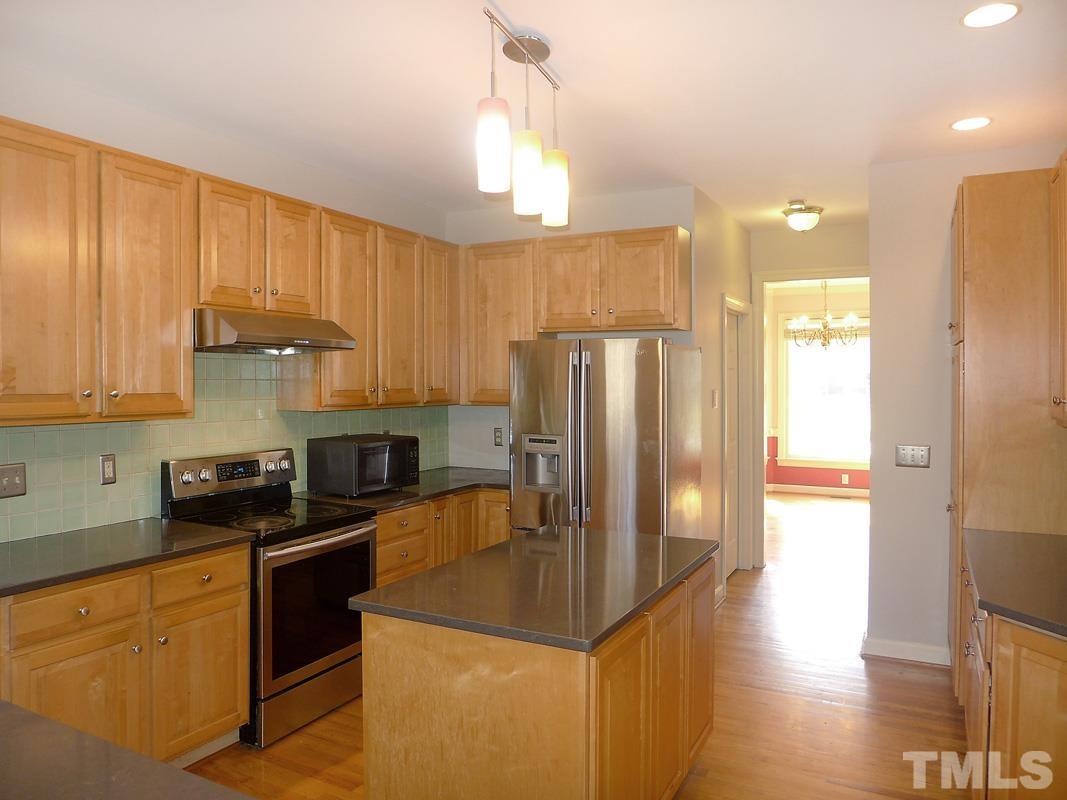 2003 Whitmore Circle Chapel Hill, NC 27516 - Photo 15 of 35 a kitchen with stainless steel appliances granite countertop a refrigerator a stove and a sink