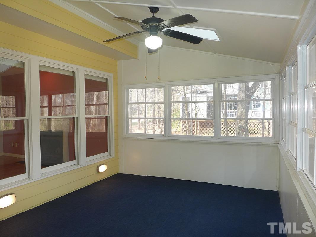 2003 Whitmore Circle Chapel Hill, NC 27516 - Photo 20 of 35 a view of an empty room with a window and wooden floor