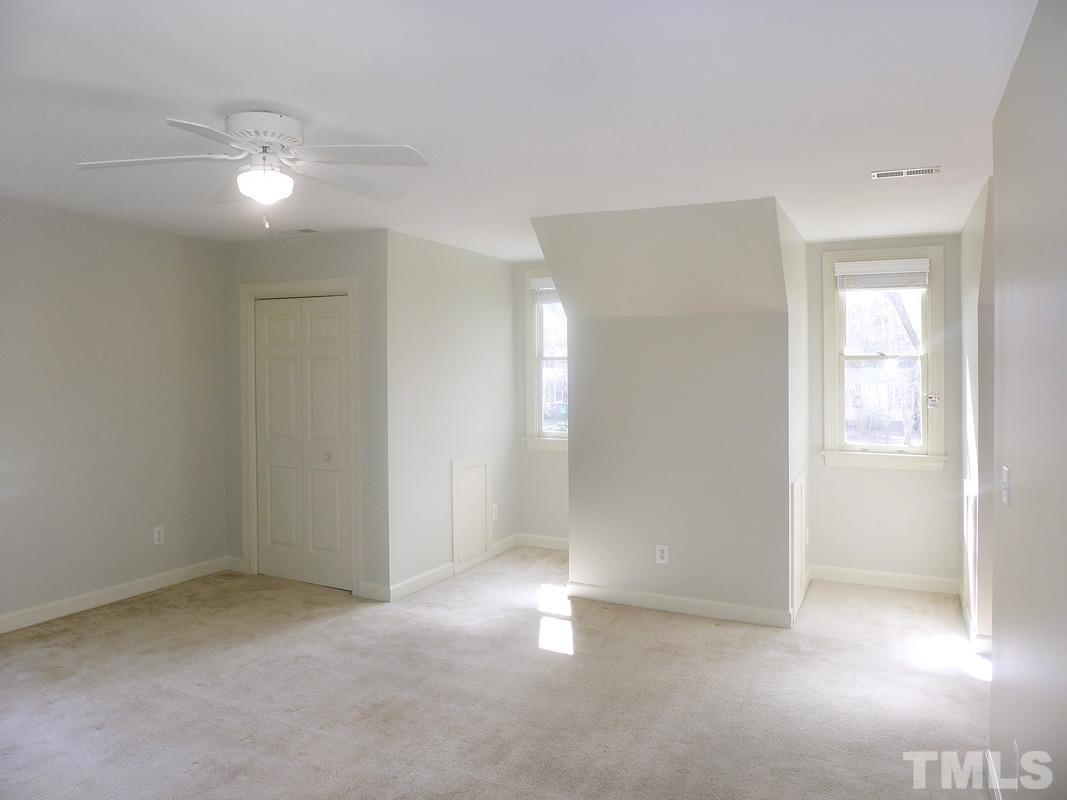 2003 Whitmore Circle Chapel Hill, NC 27516 - Photo 24 of 35 an empty room with closet and windows