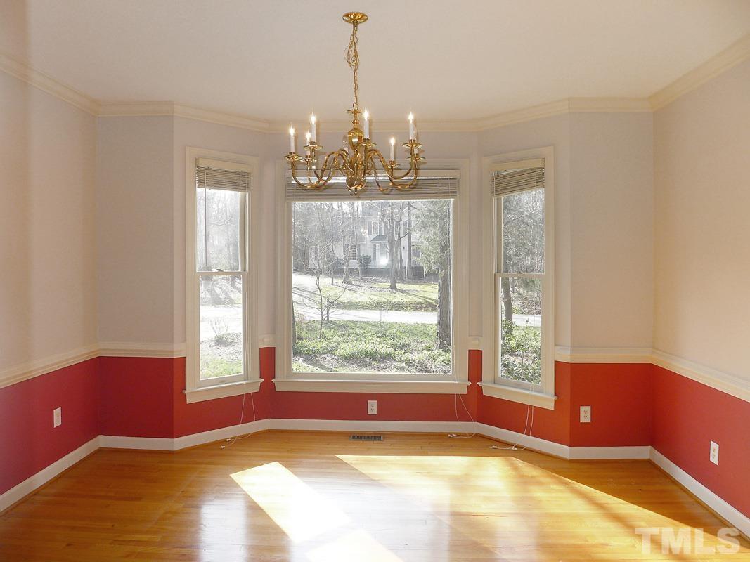 2003 Whitmore Circle Chapel Hill, NC 27516 - Photo 8 of 35 a view of a living room with a large window and chandelier