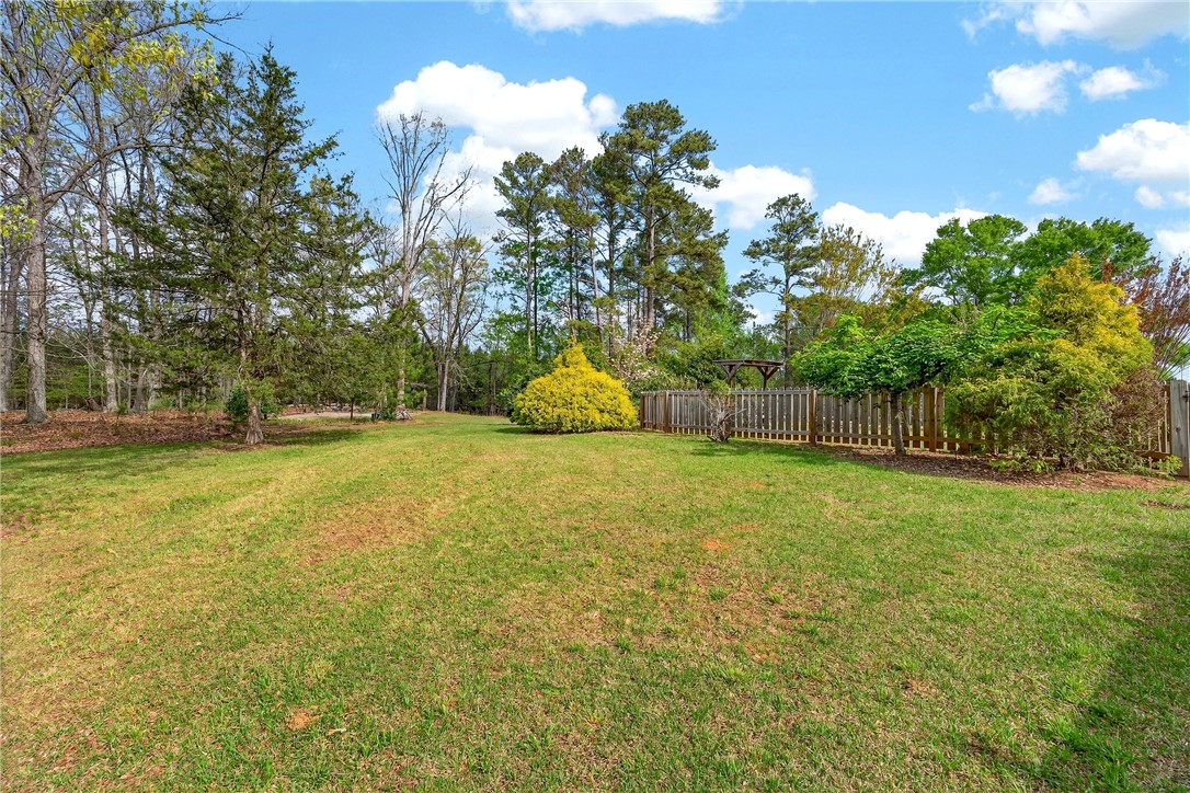 160 Burdette Circle Pendleton, SC 29670 - Photo 33 of 38 Expansive green yard with mature trees offers a serene natural escape.