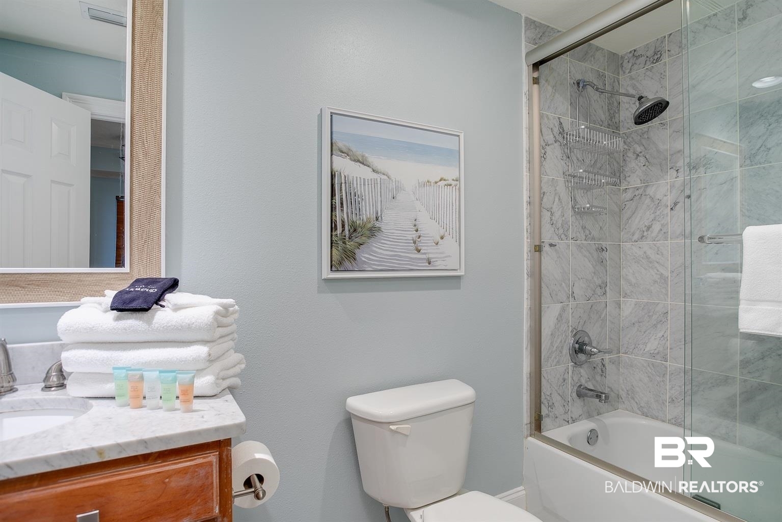 27800 Canal Road, Unit 411 Orange Beach, AL 36561 - Photo 22 of 49 Bathroom featuring a shower-over-tub combination with glass enclosure, tiled surround, and a rain showerhead