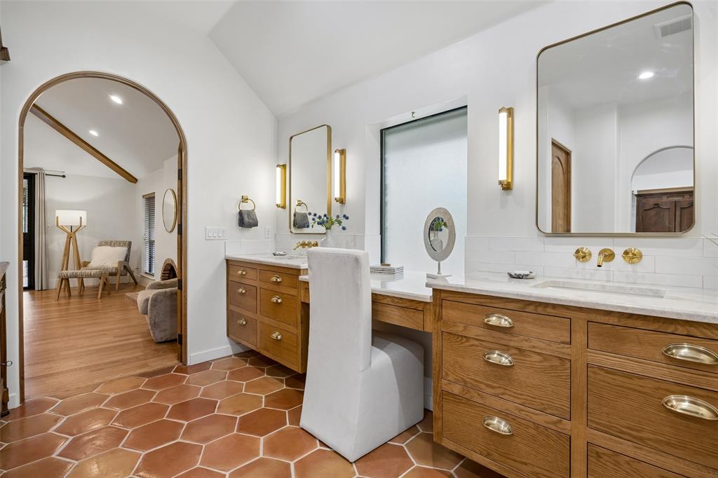 1620 Timber Ridge Lane Keller, TX 76262 - Photo 16 of 40 Primary bath is filled with warm organic textures, custom cabinetry, and gold fixtures