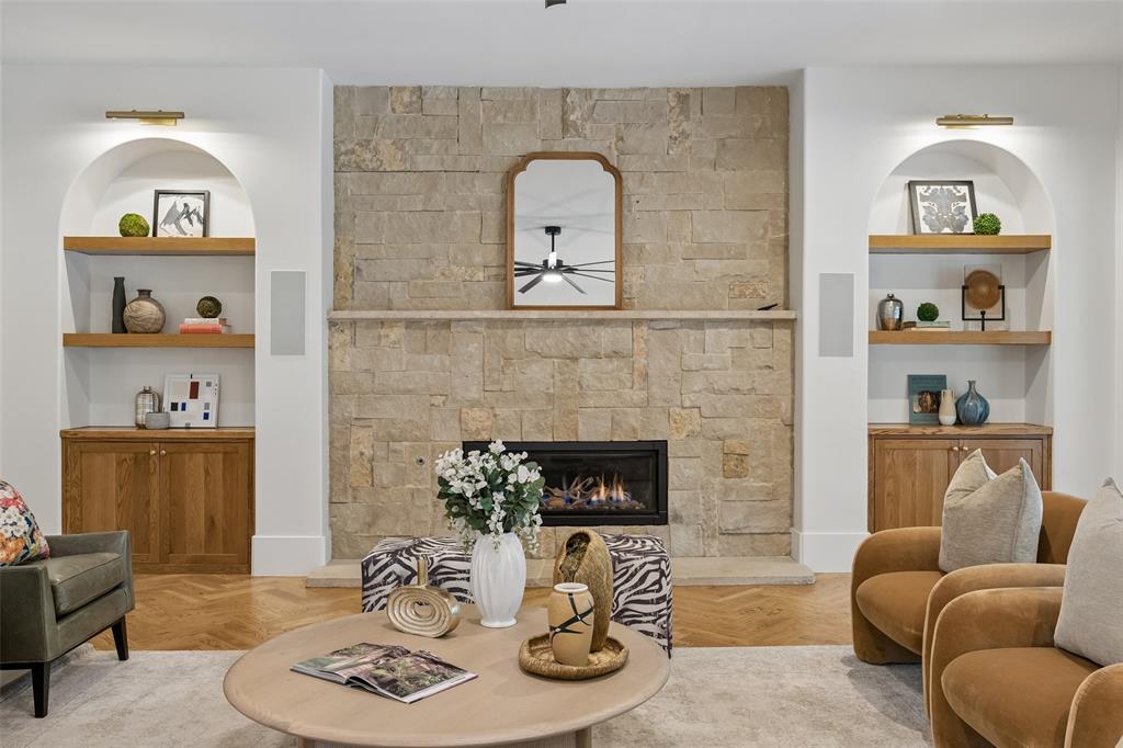 1620 Timber Ridge Lane Keller, TX 76262 - Photo 2 of 40 Custom built-ins add character and functionality that surround the floor to ceiling stone fireplace