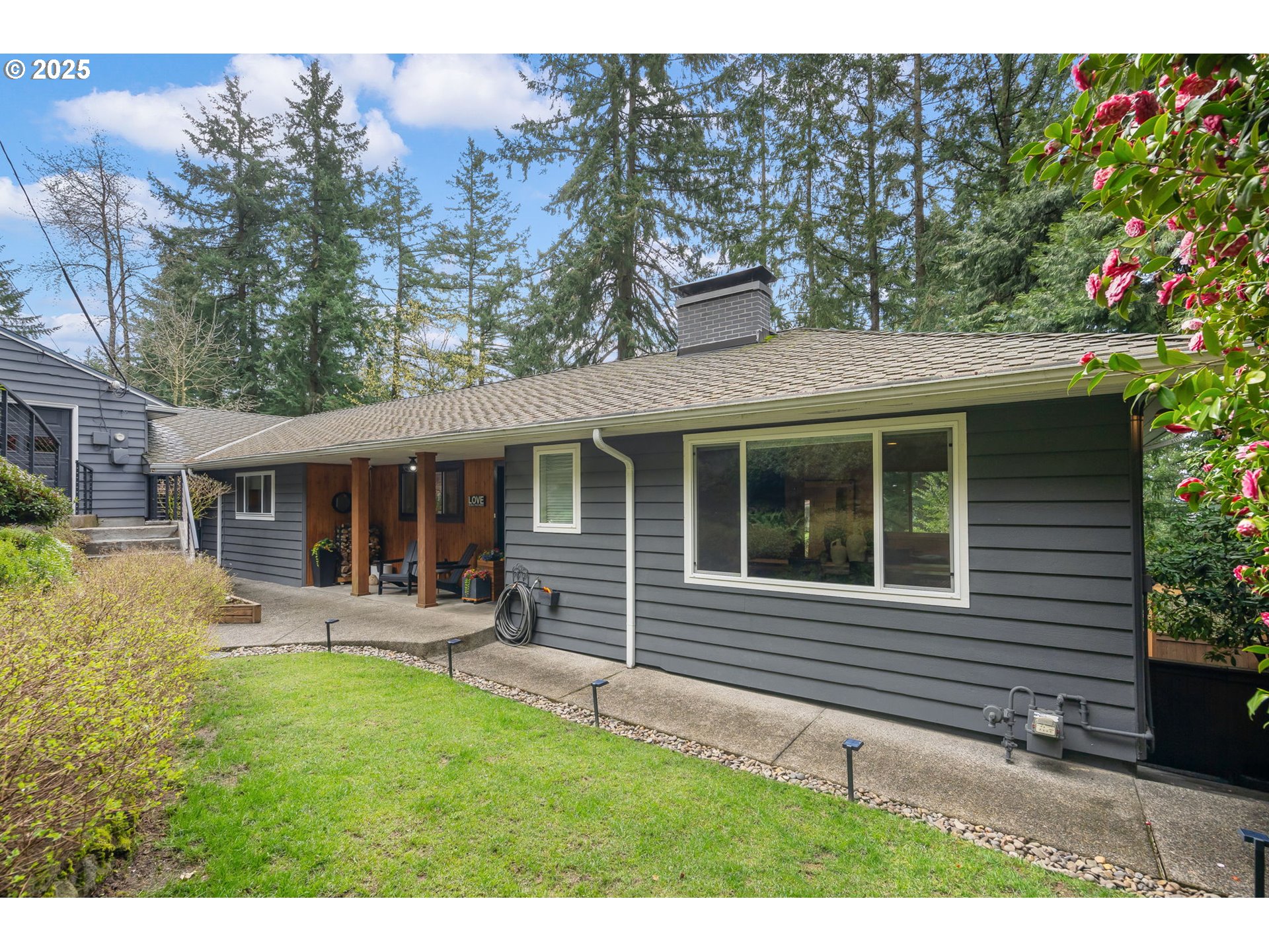 4933 Southwest 18th Place Portland, OR 97239 - Photo 1 of 43 a front view of a house with patio