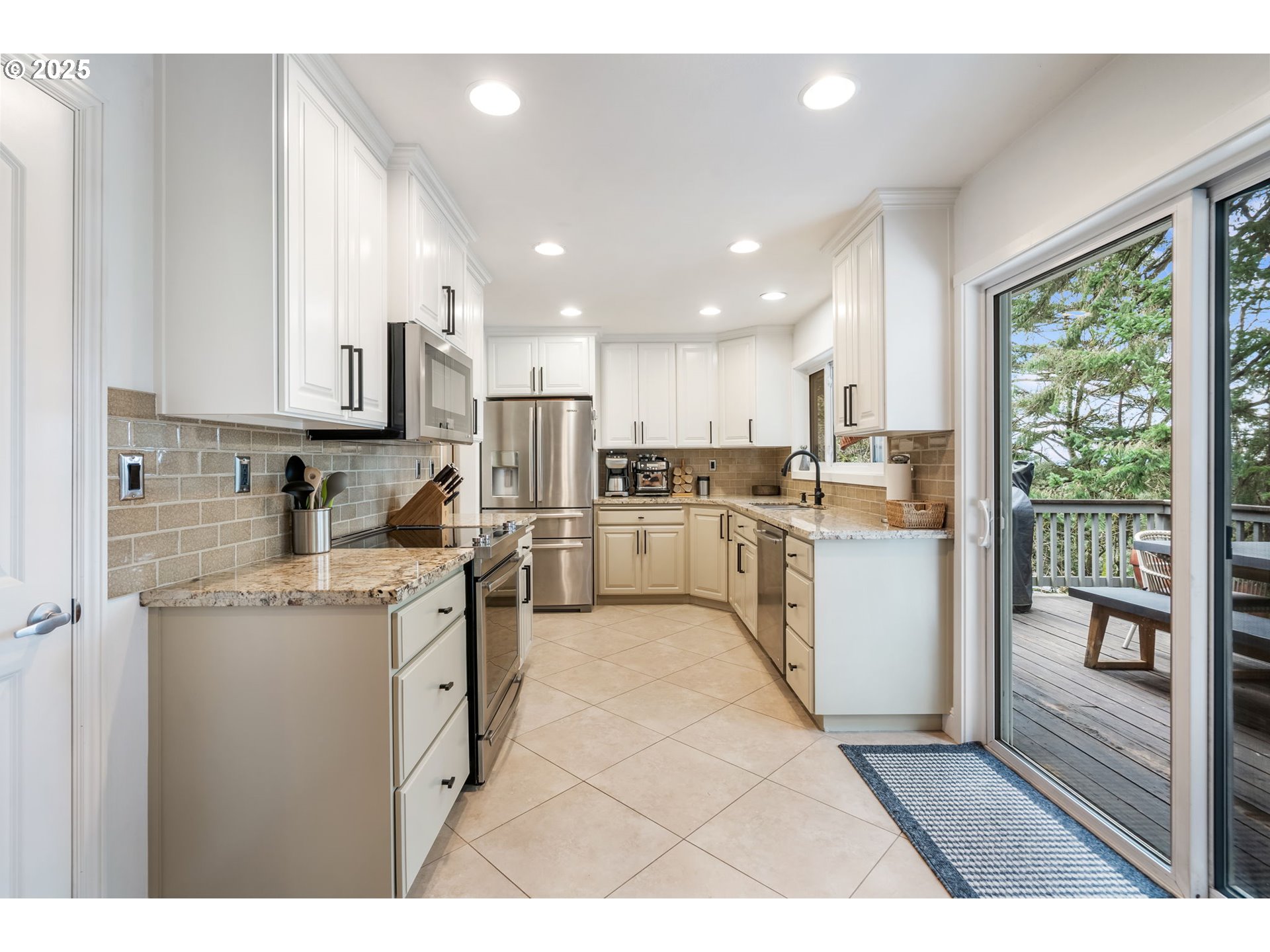 4933 Southwest 18th Place Portland, OR 97239 - Photo 11 of 43 a kitchen with appliances cabinets and a sink