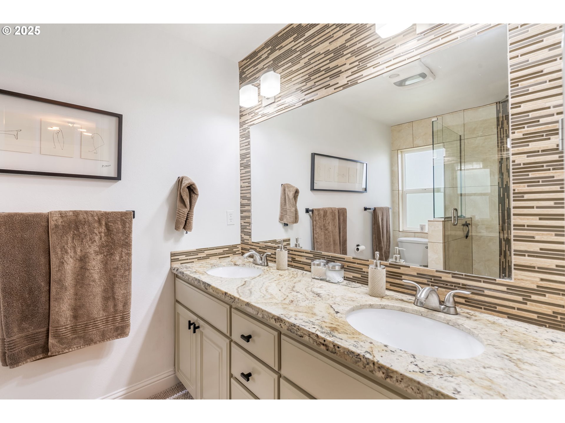 4933 Southwest 18th Place Portland, OR 97239 - Photo 20 of 43 a bathroom with a granite countertop sink mirror and double