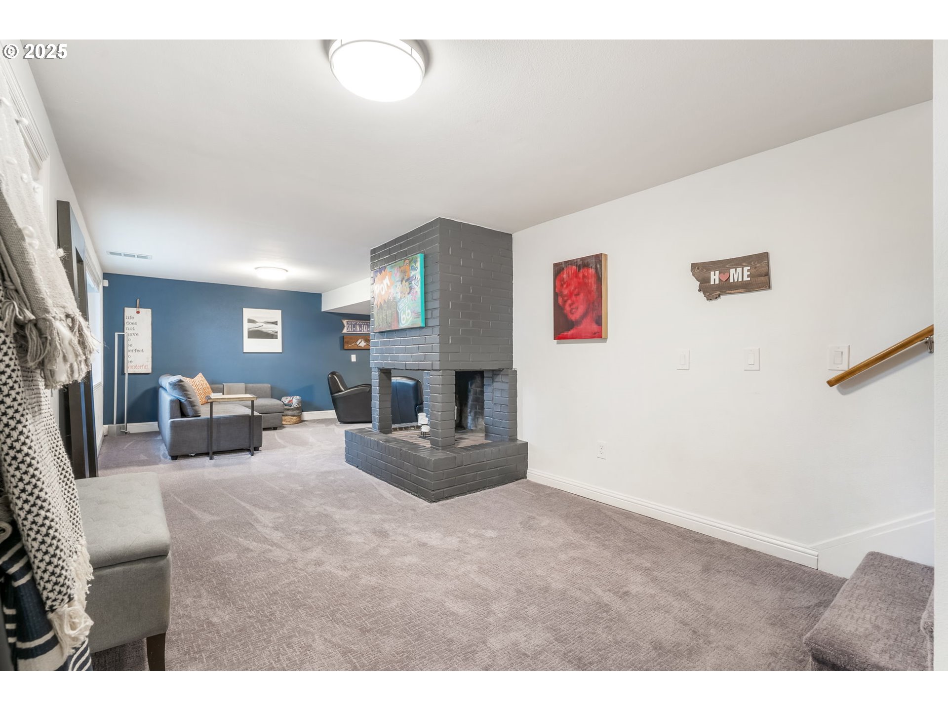 4933 Southwest 18th Place Portland, OR 97239 - Photo 24 of 43 a living room with furniture and a fireplace