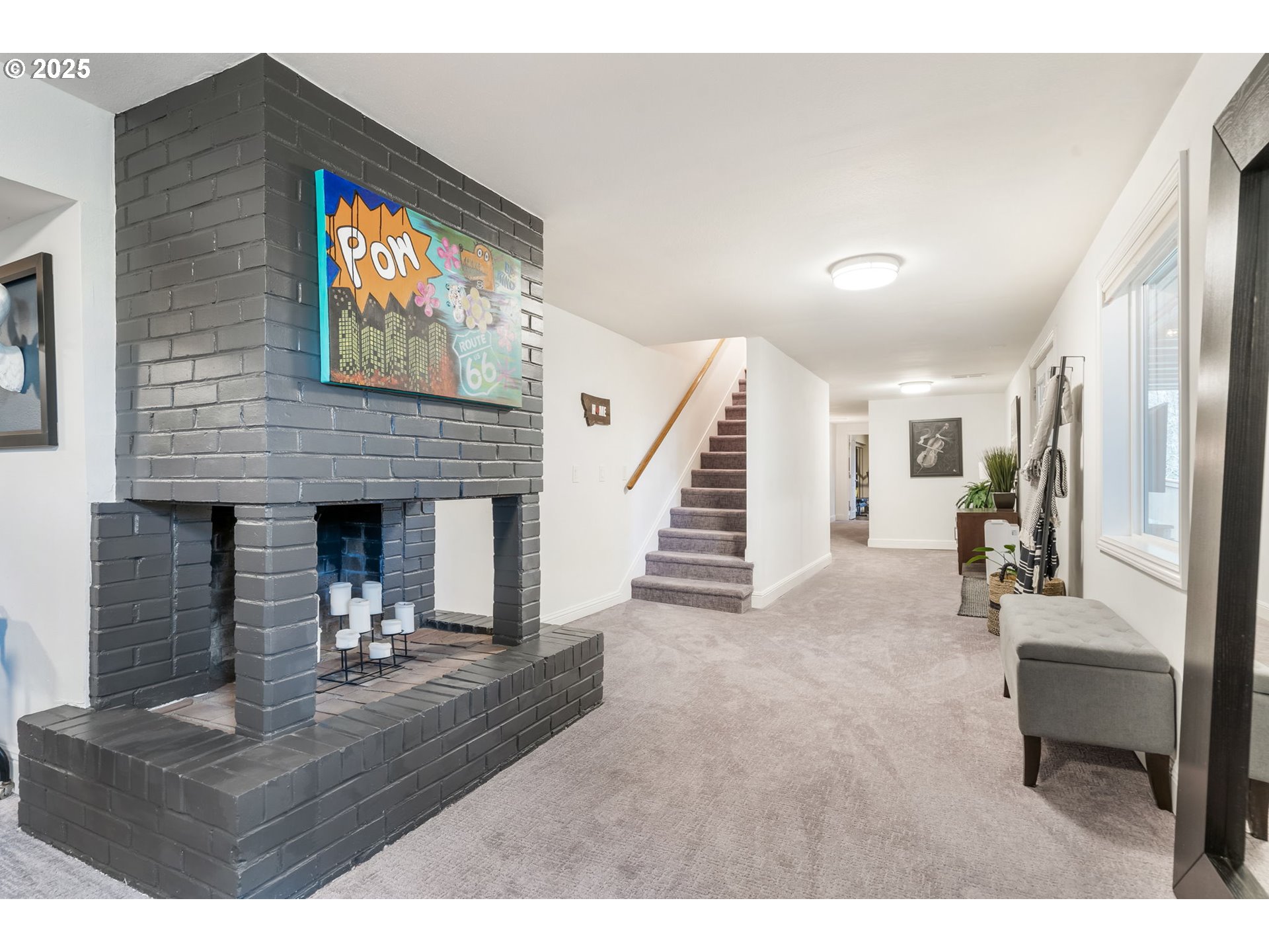 4933 Southwest 18th Place Portland, OR 97239 - Photo 26 of 43 a living room with furniture and a fireplace