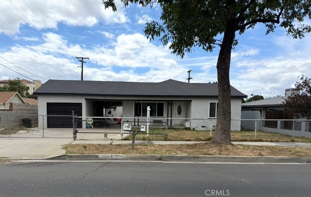 3904 Monroe Street Riverside, CA 92503 - Photo 1 of 22 a front view of a house with garden
