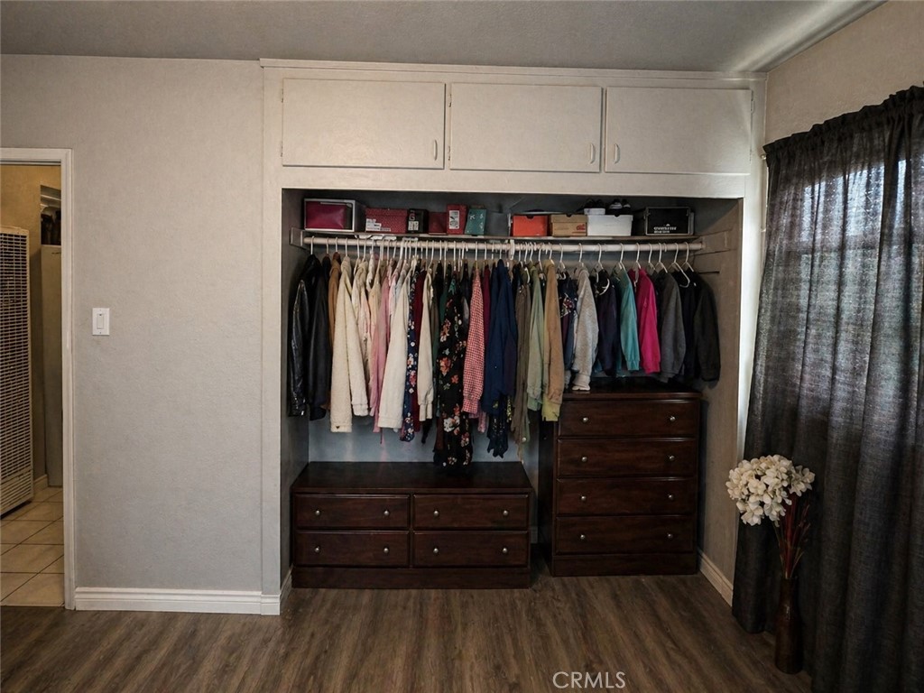 3904 Monroe Street Riverside, CA 92503 - Photo 12 of 22 a view of walk in closet with clothes