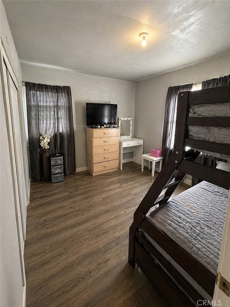 3904 Monroe Street Riverside, CA 92503 - Photo 13 of 22 a living room with furniture flat screen tv and refrigerator