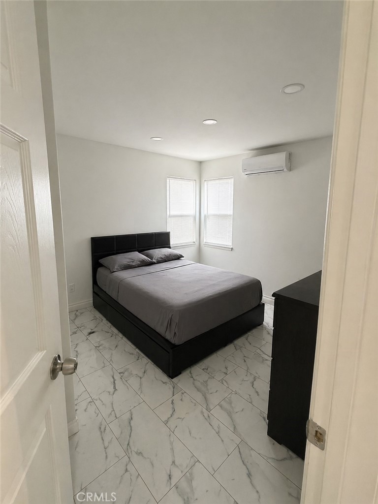 3904 Monroe Street Riverside, CA 92503 - Photo 18 of 22 a bedroom with a bed and a chair