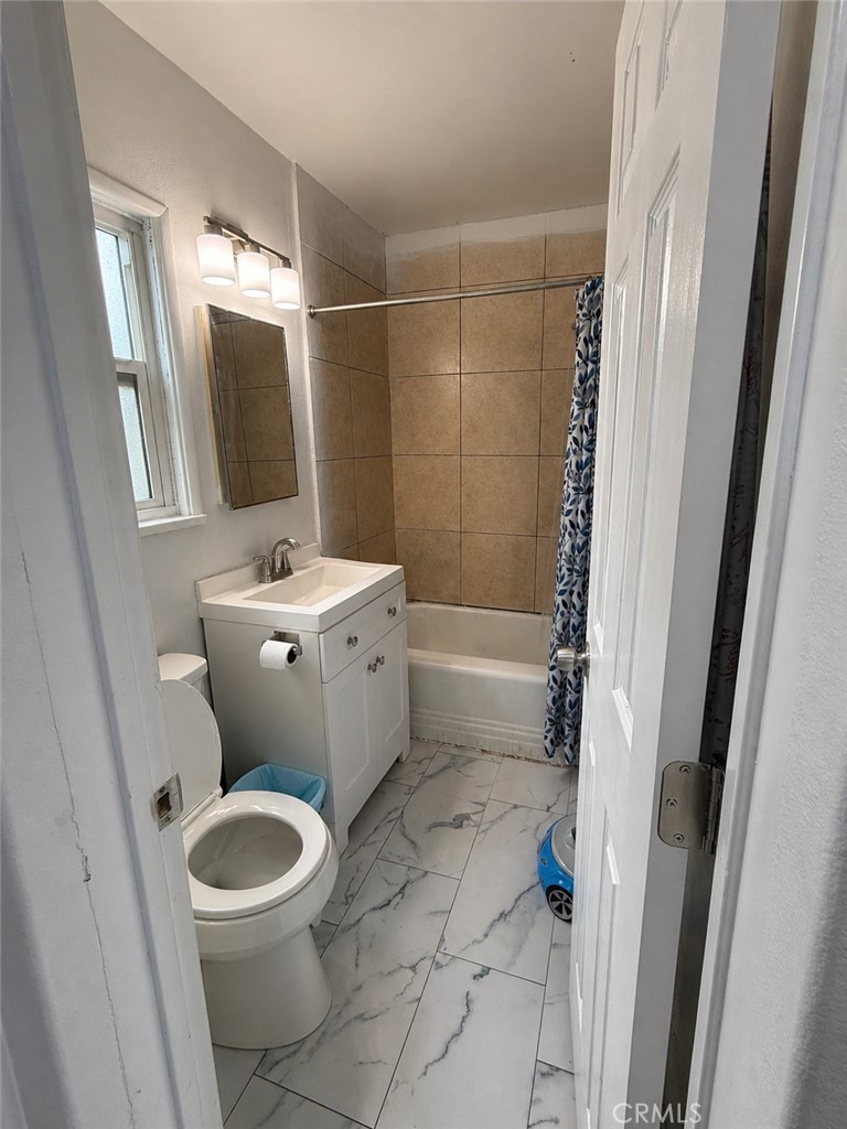 3904 Monroe Street Riverside, CA 92503 - Photo 22 of 22 a bathroom with a sink a toilet and shower