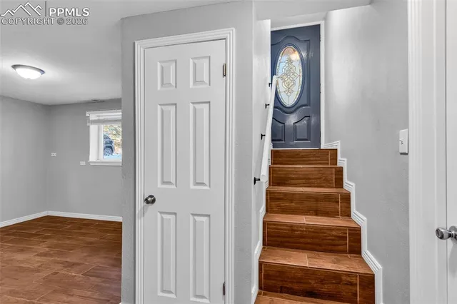 a view of entryway with wooden floor