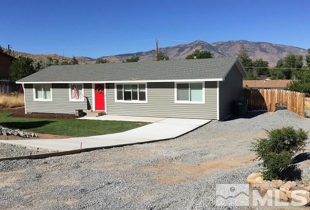 8895 Reservoir Street Reno, NV 89506 - Photo 1 of 1 front view of house with a yard