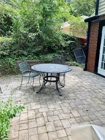 a view of a terrace with furniture