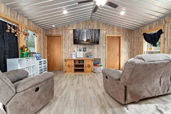 a living room with furniture and a flat screen tv
