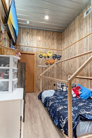 a view of a room with wooden ceiling
