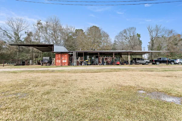 a view of swimming pool with trees in front of it