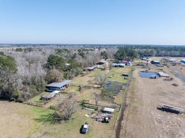 an aerial view of a house with beach