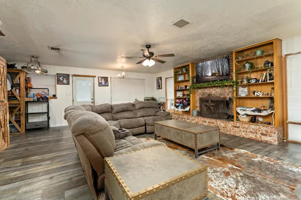 a living room with furniture and a fireplace