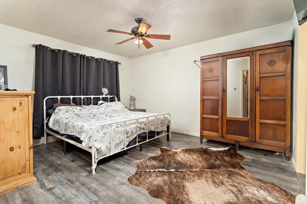 a bedroom with a bed and a table