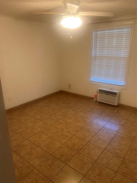 2490 Southwest 14th Drive, Unit 29 Gainesville, FL 32608 - Photo 11 of 20 an empty room with windows