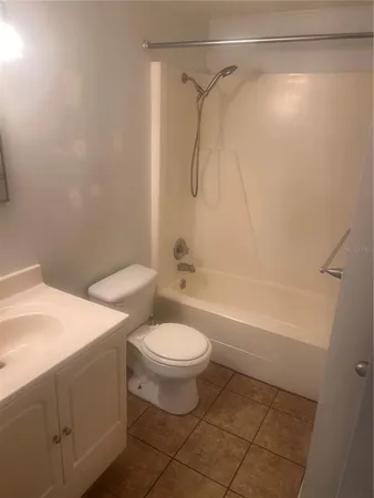 a bathroom with a sink a toilet and a bathtub