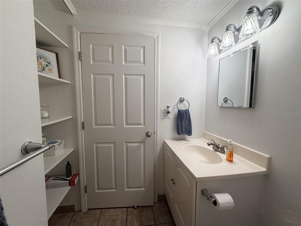 2490 Southwest 14th Drive, Unit 29 Gainesville, FL 32608 - Photo 14 of 20 a bathroom with a sink and a mirror