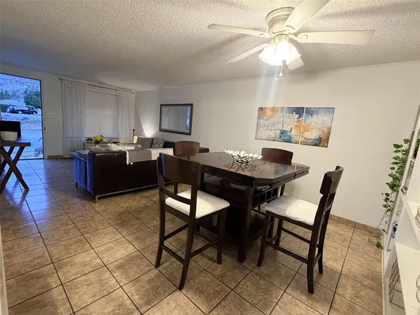 a living room with furniture and a lamp