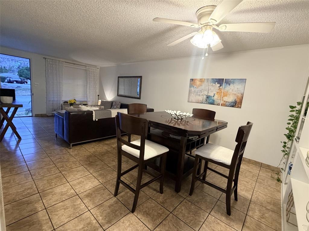 2490 Southwest 14th Drive, Unit 29 Gainesville, FL 32608 - Photo 19 of 20 a dining room with furniture and window