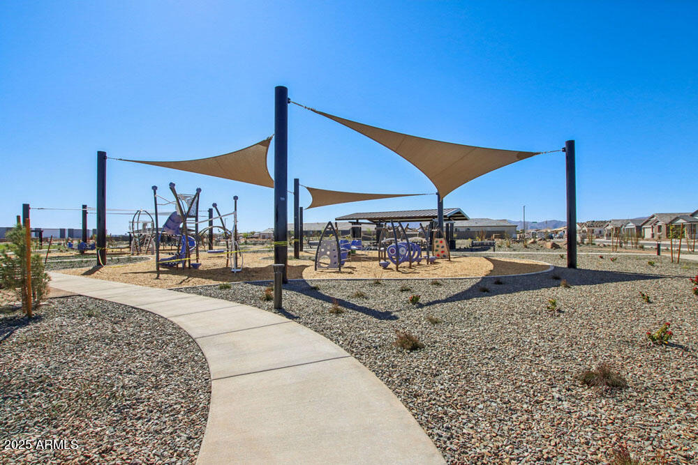 15715 West Camden Avenue Waddell, AZ 85355 - Photo 18 of 20 a view of a swimming pool with a lounge chairs