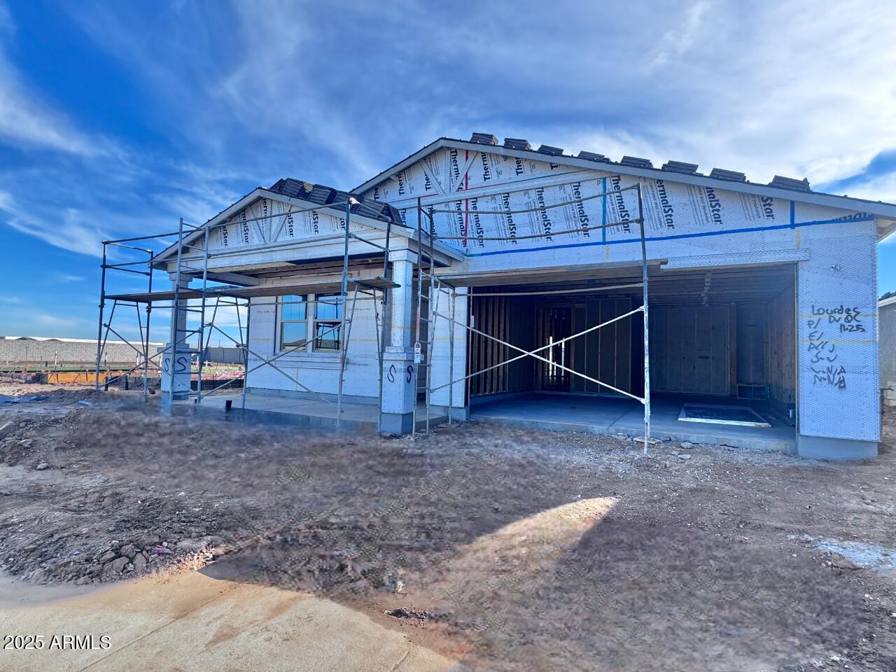 15715 West Camden Avenue Waddell, AZ 85355 - Photo 2 of 20 a view of a house with a backyard and porch